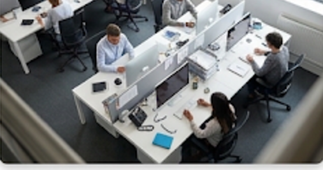 A busy open-plan office floor seen from above